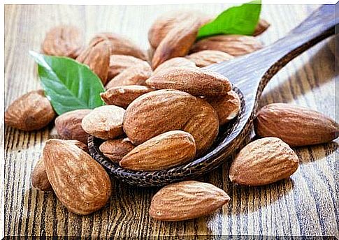 wooden spoon of almonds