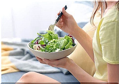 Woman eating lettuce