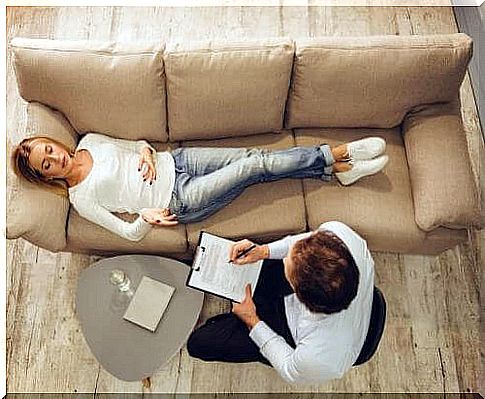 Emotional suffering - a woman at a psychologist's couch