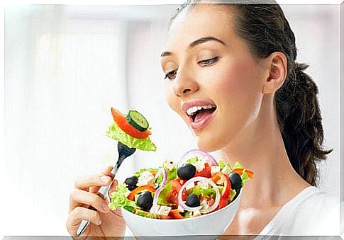 Woman with a bowl of salad 