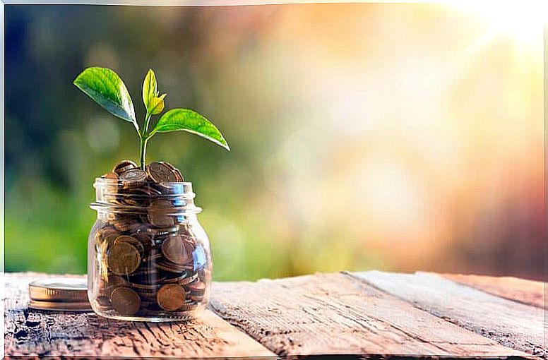 Saving, a jar filled with coins