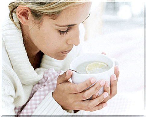 woman with cup of infusion