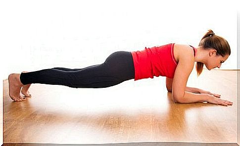 A woman is doing a plank exercise