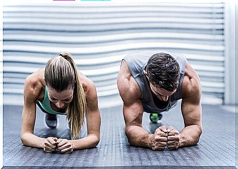 The couple do a plank