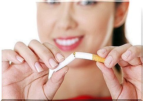 Woman destroying a cigarette - reasons to quit smoking