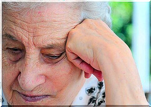 Elderly woman props her head, voice nurturing