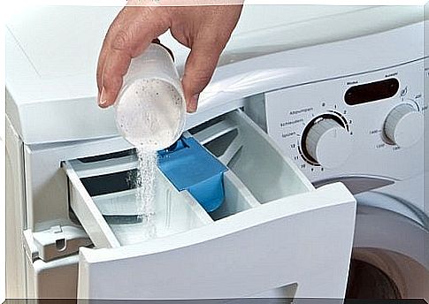 Pouring the powder into the dispenser in the washing machine